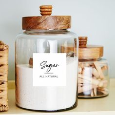 some jars are filled with sugar and wooden spoons