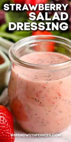 strawberry salad dressing in a jar with strawberries