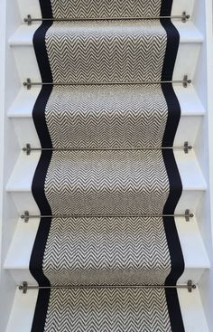 a stair case with black and white chevrons