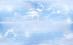 an artistic image of bubbles floating in the air over water with stars and sparkles