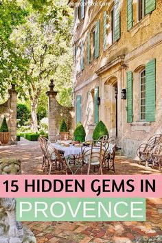 an outdoor patio with tables and chairs in front of a building that says 15 hidden gems in provence