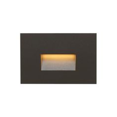 an outdoor light that is on the side of a white wall with a black frame