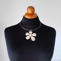 Beautiful minimalist necklace made with a gorgeous flower brass pendant, nickel free. It is a stunning piece, perfect to make everyone's attention turned on you. Choker included ! Contains no lead or nickel. Do not perfume over it or subject it to any liquid substances. I love the pure metal. But over time, metal will darken slightly, but when you rub stationery eraser, brilliance will return. Composition: I always use natural materials, in this case real brass. The materials I use, are made from a small local traditional company. They use natural products such as cotton, silk and viscose and they love colors. The materials are really expensive here compared with them are made in others country but they are ecological, skin friendly, they don't fade and they have very good resistance. Τhei Adjustable Metal Necklace With Flower Pendant, Adjustable Metal Flower Pendant Necklace, Metal Flower Charm Necklaces, Adjustable Nickel-free Necklace With Flower Pendant, Adjustable Sterling Silver Flower Necklace, Nickel-free Adjustable Flower Pendant Necklace, Silver Flower-shaped Metal Necklace, Silver Flower Shaped Metal Necklace, Silver Metal Necklace In Flower Shape