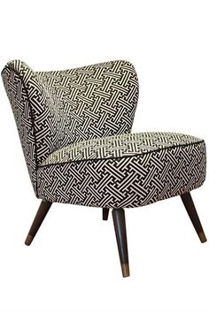 a black and white patterned chair with wooden legs