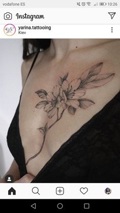 a woman with a flower tattoo on her chest