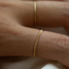 Barely there ring in 14k GoldModern and timeless Dainty Curb Chain Ring 1.2mm in thickness Available in 14k yellow gold, white gold and rose gold Dainty Gold Chain Ring, Delicate Yellow Gold Chain Ring, Edgy Rings, Gold Chain Ring, Dainty Gold Chain, Everyday Accessories, Chain Ring, Curb Chain, Ring Designs