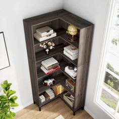 a corner book shelf with books and other items on it in the corner of a room