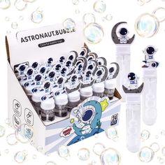 an assortment of bubbles and water bottles in a cardboard box with the contents labelled as astronauts