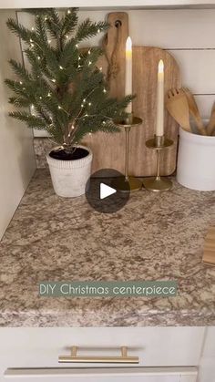 a small christmas tree sitting on top of a counter