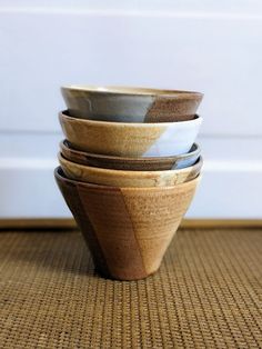 a stack of wooden bowls stacked on top of each other