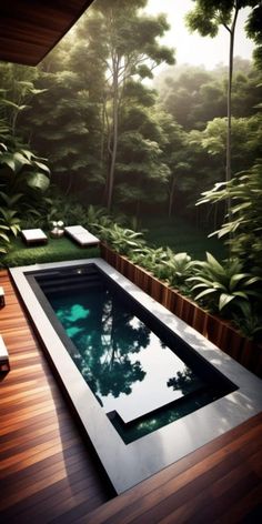 an outdoor swimming pool surrounded by greenery