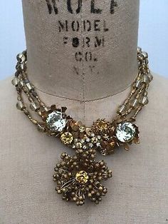 Stunning and Rare. This is a  Signed, Miriam Haskell, Citrine Filagree Rhinestone Necklace.Chain is almost 16" long. The neck of the mannequin is 13.5” around.Centerpiece is 3" x 2.75"In Excellent condition!!!Nothing damaged, nothing missing. The stones are clear and sparkly.  Very few of the metal bead connectors have a bit of tarnish on them. Please look at the pix. Stanley Hagler Jewelry, Vintage Cameo Jewelry, Costume Jewelry Makers, Vintage Statement Jewelry, Vintage Assemblage Jewelry, Juliana Jewelry, Miriam Haskell Jewelry, Rhinestone Statement Necklace, Metal Bead