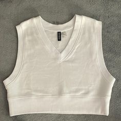 New, Without Tags Cropped Sweatshirt. White , X-Small Thanks For Looking, Non Smoking Home Sporty V-neck Crop Top For Spring, Trendy White V-neck Tank Top, White V-neck Vest Top, Stretch V-neck Vest Top, Casual White Fitted V-neck Top, Fitted White Cotton V-neck Top, White Casual V-neck Tank Top, Casual White V-neck Tank Top, Casual White Stretch V-neck Top