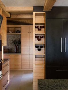 a kitchen with wooden cabinets and granite counter tops