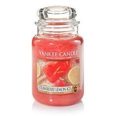 a jar of strawberry lemon ice yankee candle on a white background with the lid open