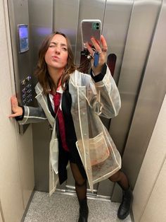 a woman taking a selfie in an elevator