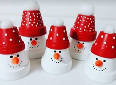 snowmen with red hats and white dots on them