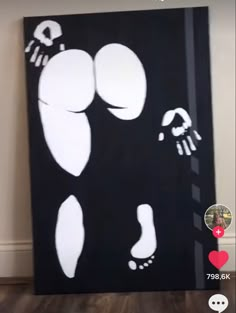 a black and white painting on the wall