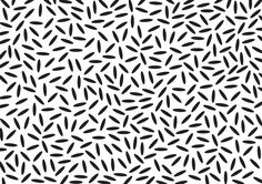 an abstract black and white background with small, irregular shapes in the shape of stars