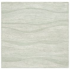 a white rug with wavy lines on it