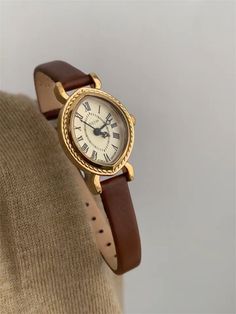 Welcome to AffordLuxe Watches! We're delighted to have you here in our store 🤩 Elevate your style with this elegant timepiece featuring a rich brown leather band and a sophisticated gold-tone case. The classic Roman numeral dial adds a touch of vintage charm, while the intricate bezel detailing enhances its luxurious appeal.  ★Material: - Genuine Leather - Stainless Steel  - Glass ★Dimensions: - Case Height: 8mm - Case Length: 25mm - Band Width: 8mm ★Packaging: All watches come in an elegant gift box with a gift bag. ★Care Instructions: - Avoid wearing the watch in the shower or frequently exposing it to hot water. - Substances like oil, nail polish, nail polish remover, chlorine, and perfume may react with metal and cause tarnishing. - Remove the watch when exercising, doing heavy work, Watch Minimalist, Gold Plated Watch, Vintage Watches Women, Deep Winter, Oval Face, Watches For Women, Leather Strap Watch, Hozier, Classy Jewelry