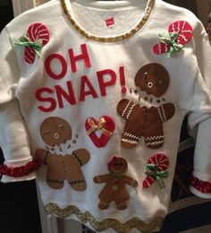 a white sweater with gingerbreads on it and the words oh snap written in red