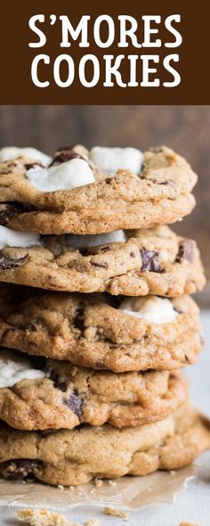 chocolate chip cookies with marshmallows are stacked on top of each other and the title reads, s'mores cookies