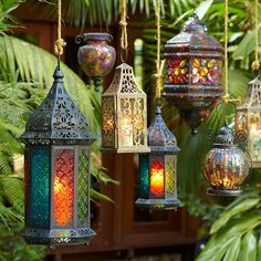 colorful lanterns are hanging from the ceiling outside