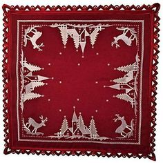 a red bandana with reindeers and trees on it