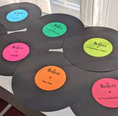 the beatles record coasters have been placed on top of each other in different colors