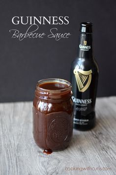 a bottle of guinness next to a jar of barbecue sauce