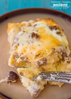 a piece of casserole on a plate with a fork