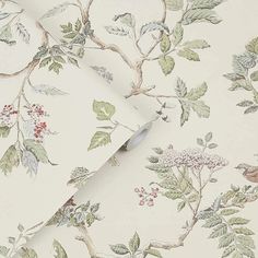 a wallpaper with birds and flowers on it's side, next to a roll of tape