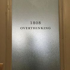 an overthiking sign on the side of a door in a building that says, 1088 overthunking