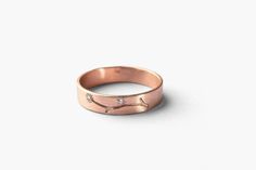 "Romantic 14K solid rose gold and two tiny natural diamonds, with a hand-engraved branch, creating a gorgeous band for women. This women's nature-inspired handcrafted band would be a wonderful gift for a precious woman, and/or a stunning and meaningful wedding band for her. ❀Features: ∙ 14K solid rose gold band ∙ Band width - 4 mm ∙ Band thickness - 0.7 mm ∙ Hand-engraved 💎 Diamonds: ∙ 2 natural and conflict-free diamonds - 1.2 mm each ∙ Total carat weight - 0.015ct ∙ All our diamonds are 100% Flat Wedding Ring, Diamonds Wedding Band, Textured Wedding Band, Wedding Band For Women, Wedding Bands For Her, Nature Inspired Rings, Yellow Gold Wedding Band, Tiny Diamond, Rose Gold Band