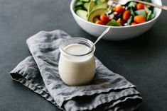 a bowl of salad and a glass of milk