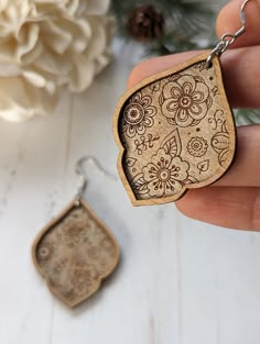 "Introducing our Nature Engraved Wood Earrings, a stunning addition to any jewelry collection. These double layer earrings are crafted from high-quality wood, ensuring durability and longevity. The intricate nature-inspired engravings add a touch of elegance and sophistication to any outfit. With their lightweight design and comfortable fit, these earrings are perfect for everyday wear. Treat yourself or someone special to these beautiful and unique earrings today. Product detail: Height: 1.75\", width 1.35. Drop length with ear-wire hooks 2.5\" Each earring is made with dedication and love by me in my home studio. If you want to see behind the scenes of the process of how I make the earrings and the packaging, follow me on Instagram or Facebook. Positive reviews are always helpful, and I' Layer Earrings, Laser Engraved Earrings, Wood Jewelery, Wood Dangle Earrings, Laser Cut Wood Earrings, Laser Cut Wood Crafts, Cherry Flower, Laser Engraved Ideas, Laser Cut Earrings