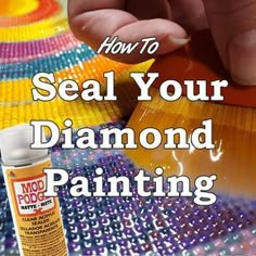 someone using a paint brush to seal their diamond painting on the tablecloth with text overlay that reads how to seal your diamond painting