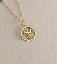 14K Real Solid Gold phoenix gold necklace ● Material of pendant: Solid Gold 14k ( REAL GOLD ) ● Metal Stamp: 14L ( REAL GOLD ) ● The pendant is available in 6 sizes: - 14,0 mm / 0,55 inches ( Diameter ) In the photos - 15,3 mm / 0.60 inches ( Diameter ) - 16,5 mm / 0,65 inches ( Diameter ) - 19,1 mm / 0,75 inches ( Diameter ) - 21 mm / 0,82 inches ( Diameter ) - 23 mm / 0.90 inches ( Diameter ) ( In the photos the size is 14mm / 0.55 inches Diameter ) ( Jump Ring inner diameter: 4 mm ) ● Materia Phoenix Bird, Bird Necklace, Bird Pendant, Amber Stone, Necklace Personalized, Garnet Rings, Gold Charm, Jump Rings, Metal Stamping