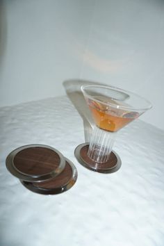 Looking for unique coasters or mid century coasters to enhance your hosting?  These coasters are an ode to the timeless elegance of the 70's & are the perfect mid century modern drink coasters for any home. Coaster Set, Dean, Timeless Elegance, Walnut, Coasters, Sleek, Stainless Steel, Tableware, Furniture