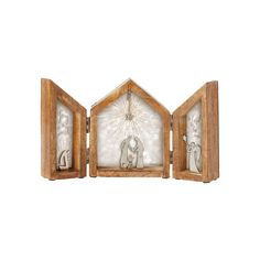 three wooden frames with nativity figures in them on a white background, one holding a star