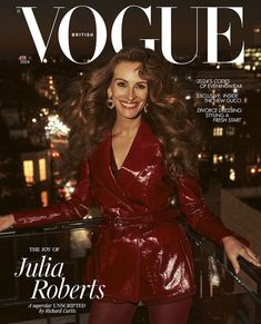 a woman in a red leather outfit on the cover of a magazine