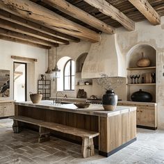 a large kitchen with an island in the middle