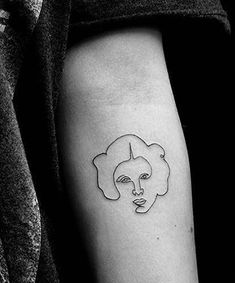 a woman's face is shown on the arm