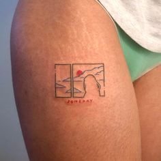 a woman with a tattoo on her thigh