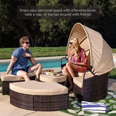 a man and woman sitting on chairs next to a pool with an umbrella over them