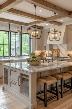 a large kitchen with an island in the middle and lots of stools around it