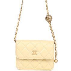 This Chanel Mini Pearl Crush Belt Bag is in light yellow lambskin leather with antique gold hardware, featuring signature quilt leather, signature CC logo on front, CC snap closure and an adjustable interwoven antique gold tone chain link with light yellow leather belt bag strap with quilted CC "ball" crush stopper.The interior is lined in beige grossgrain fabric.Collection: 30-Series (2019-2020)Origin: ItalyCondition: New and never wornAccompanied by: Chanel box, Chanel dustbag, COA card, felt and carebookMeasurements: 5" width x 3.75" height x 1" depth; adjustable belt bag strap: 15.5" Designer Quilted Beige Shoulder Bag, Luxury Quilted Cream Shoulder Bag, Luxury Quilted Beige Bag, Gold Quilted Leather Shoulder Bag, Designer Quilted Gold Shoulder Bag, Designer Gold Quilted Shoulder Bag, Chanel Box, Signature Quilts, Louis Vuitton Shop