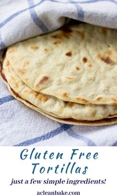 three pita breads sitting on top of a blue and white checkered cloth