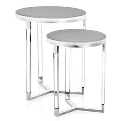 two white tables with metal legs on each side